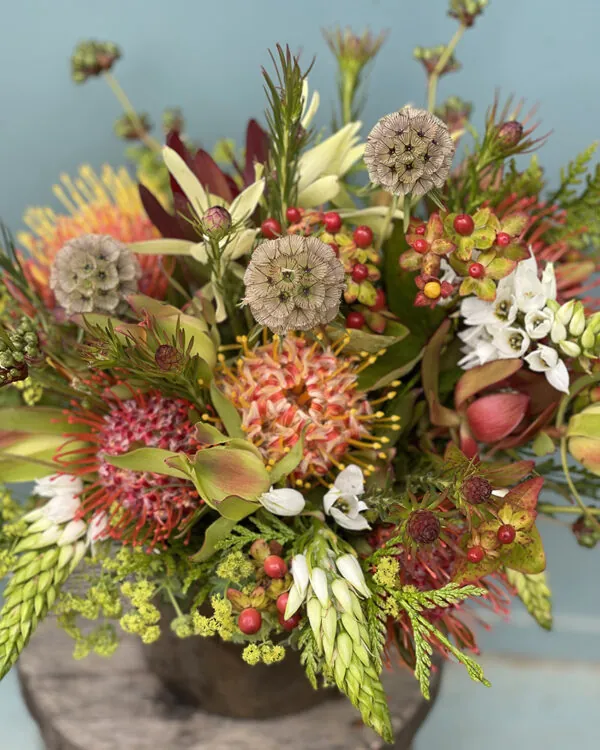 Long lasting festive arrangement in gold vase